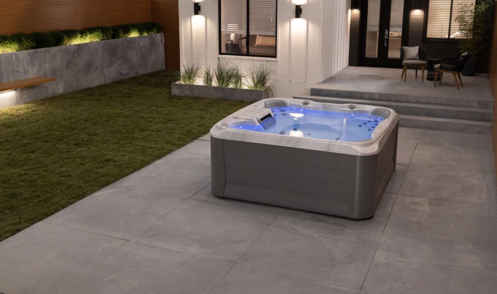 sundance spas 680 edison porcelain slate lifestyle night