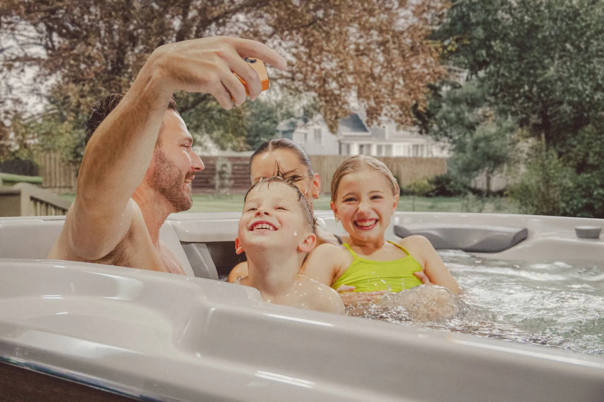 family enjoying in surf 17 swim spa