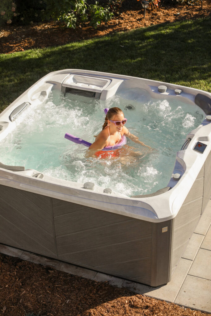 Sundance Spas 880 Series Hot Tub: Girl Relaxing 10